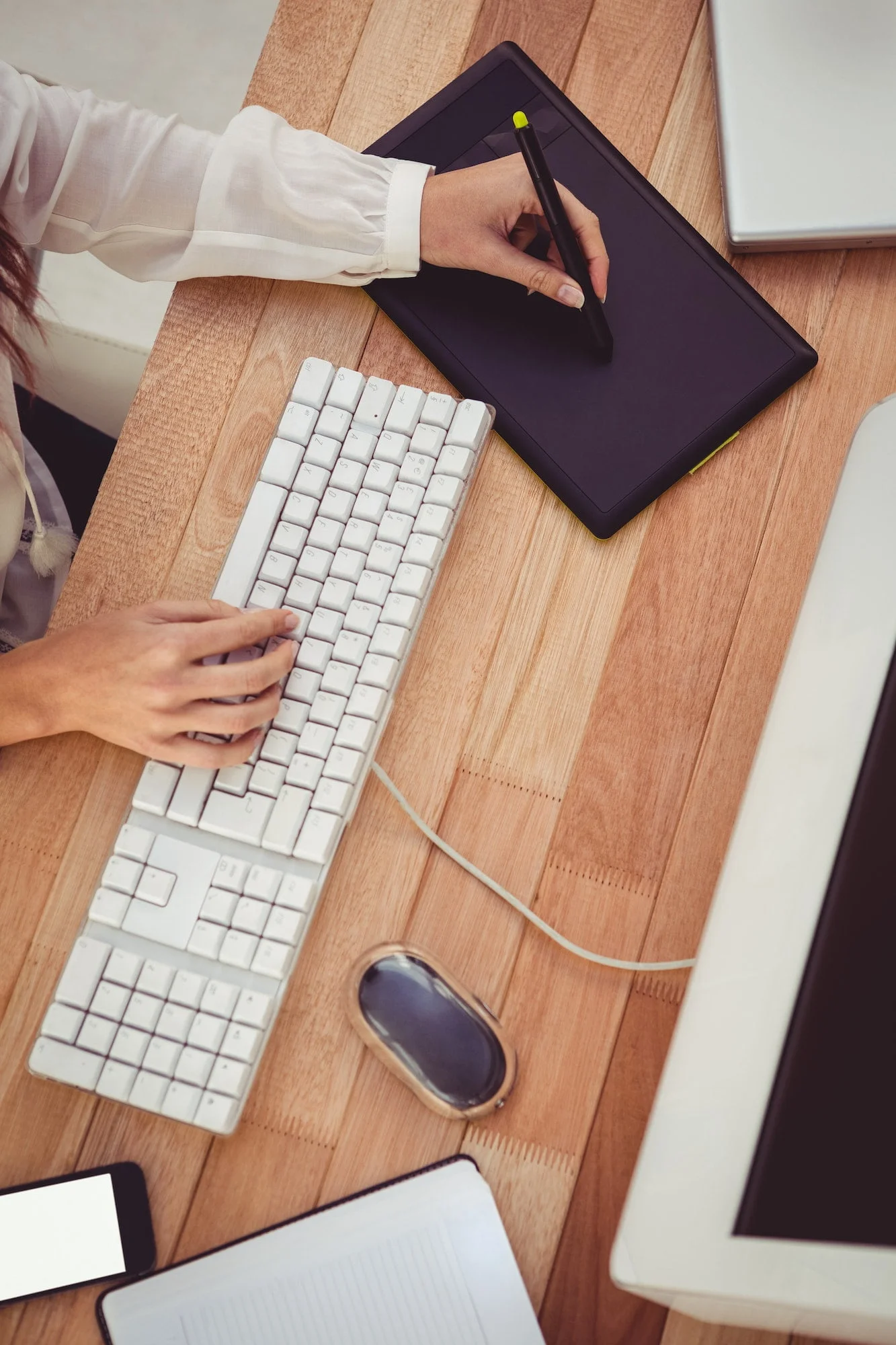 cropped-image-using-graphics-tablet-in-her-office.jpg